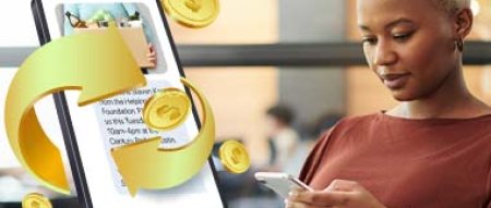 Business person sending an SMS text from their office desk